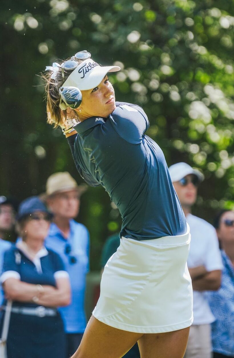 Golf player who just hit the ball